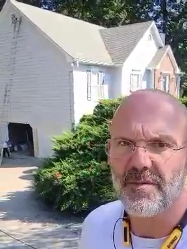 James Wheeler of Wheeler Painting in front of a Cumming, GA home being prepped for a full exterior repaint